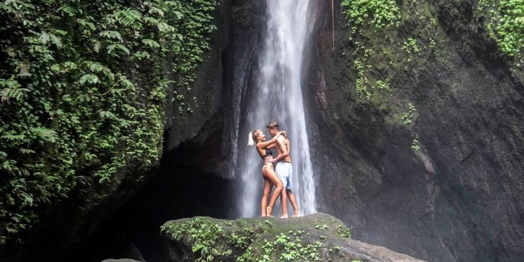 Bali Secret Waterfall Tour – Off-the-Beaten-Path Nature Escape Hidden jungle waterfall in Bali surrounded by lush greenery
