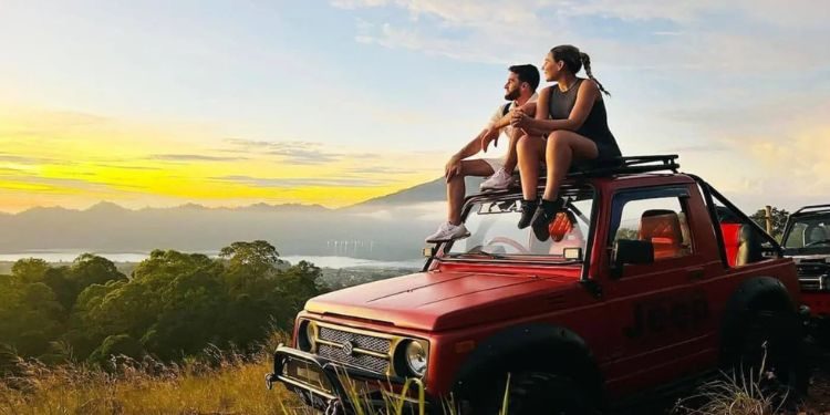 Mount Batur Jeep Sunrise Tour – Volcano Views Without the Hike Sunrise view from Mount Batur with 4x4 jeep in foreground
